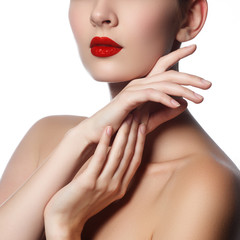 Obraz na płótnie Canvas Close-up shot of woman lips with glossy red lipstick