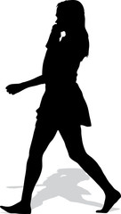 Vector silhouette of the walking girl with a handbag and mobile 