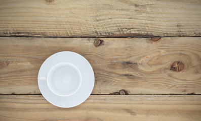 Empty white coffee cup on old wooden,Top view