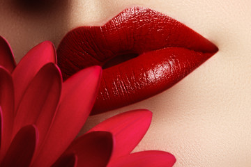 Close-up beautiful female lips with bright red make-up