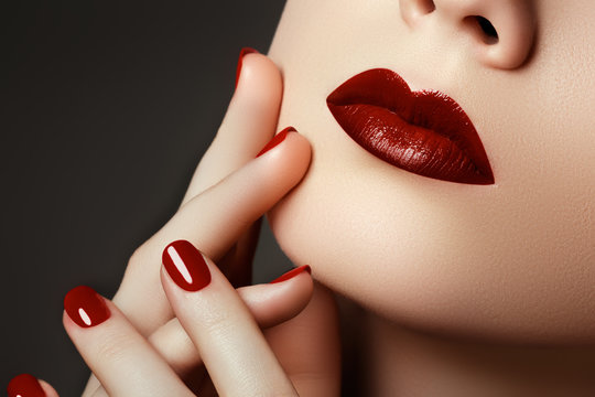 Red Sexy Lips And Nails Closeup. Open Mouth. Manicure And Make-up