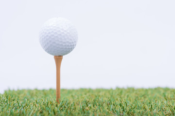 White Golf ball on green grass