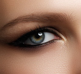 Creative eye makeup. Fashionable smoke eyes. Cosmetics and make-up