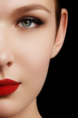 Make-up and cosmetics. Beauty woman face isolated on black background