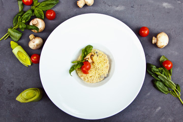 Beautiful risotto with mushroom, tomatoes cherry and Basil