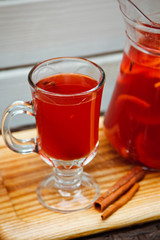 Fresh cold strawberry tea with ice and cinnamon