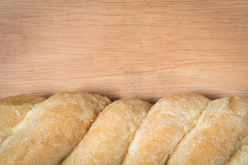bread knead with sugar and butter on a wood background with empt