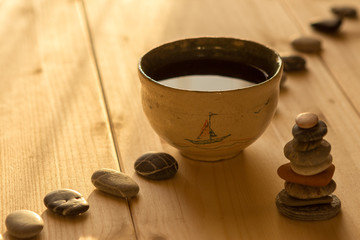 The tea into a bowl on wooden boards