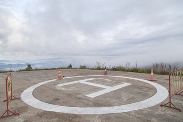 helicopter park symbol,  landing pad on mountain in bad weather