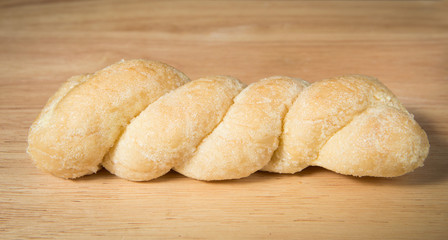 bread knead with sugar and butter on the wood background