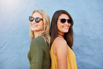 Stylish female friends wearing sunglasses