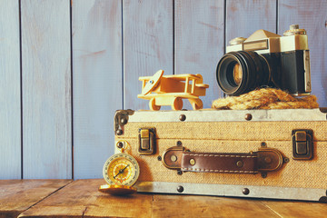 Compass, rope, old camera and toy plane. explorer concept