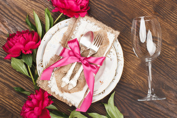Tableware and silverware with peonies