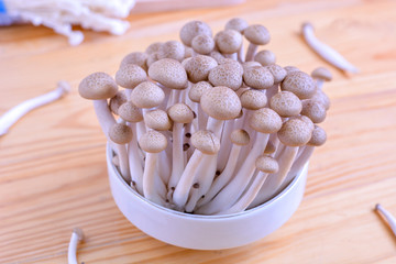 Brown beech mushroom, shimeji mushrooms on wooden background