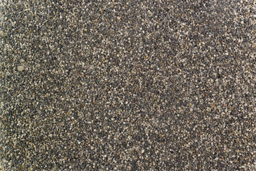 The texture of small gravel on the road