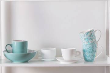 Clean dishes on wooden shelf