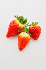 Closeup of not fully ripe strawberries