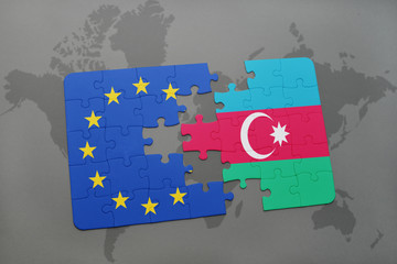 puzzle with the national flag of azerbaijan and european union on a world map background.