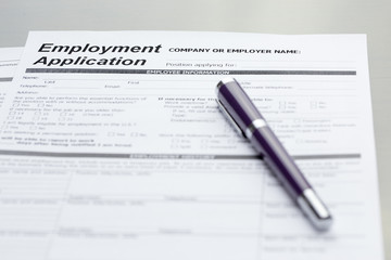 Obraz premium Employment Application information with pen. job vacancy concept or business employment concept.