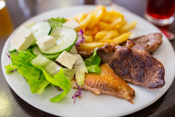 Fish and chips with salad on the plate