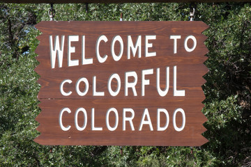 Wooden sign, Welcome to Colorful Colorado
