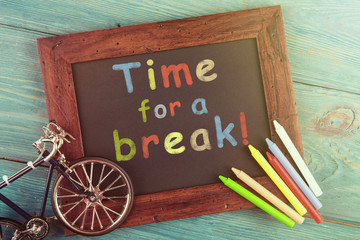 Time for a break handwritten with crayons on a blackboard