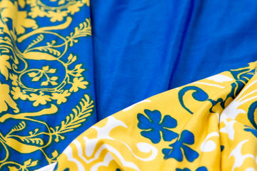 Blue, yellow and white wrinkled silk, full frame