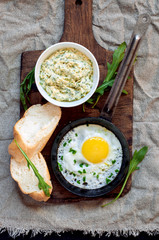 Fried egg, cheese sauce, loaf, top view