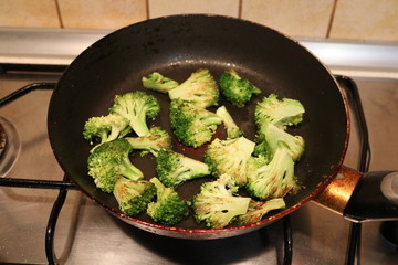 green broccoli fried in a pan ready to eat
