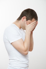 Fototapeta premium Young man closing his face