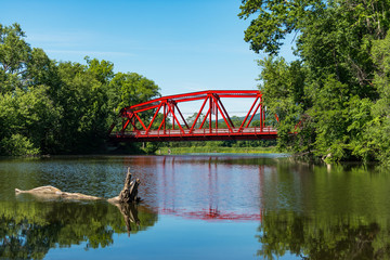Red Bridge in bright daylight on Route 32 over the Wallkill River near Rifton in Upstate New York.
