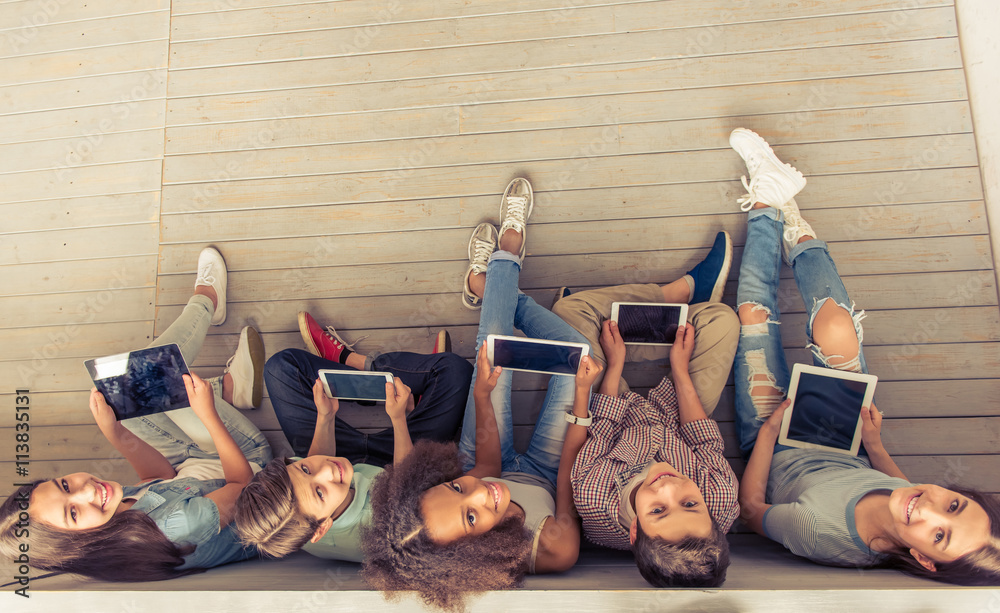 Poster teenagers with gadgets