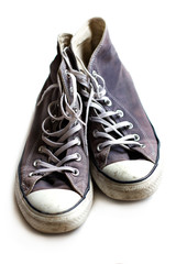 Old gray sneakers close up