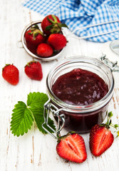 Strawberry jam and fresh strawberries