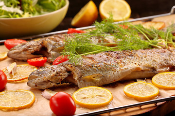 Whole baked fish on the grill