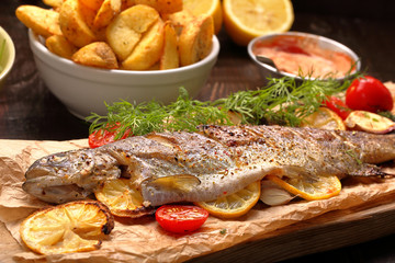 Baked fish with roasted potatoes and dip