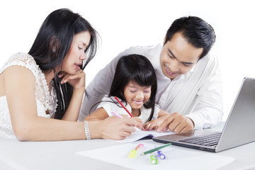 Family studying together on desk