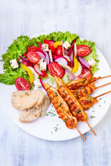 Grilled chicken on a stick with vegetables