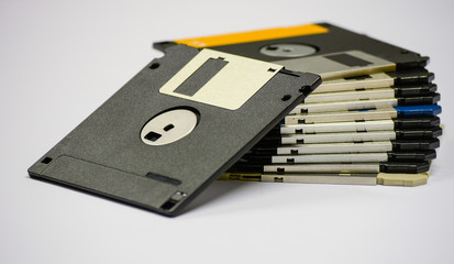 fstock of floppy disks isolated on white table