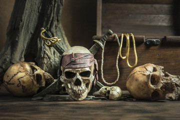 pirate skull with two swords and treasure coffer