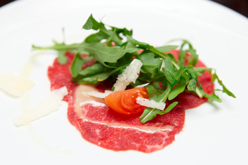 Small portion of beef capraccio