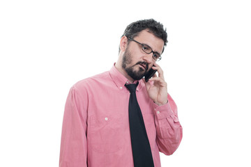 Fototapeta premium Young tired man talking on phone