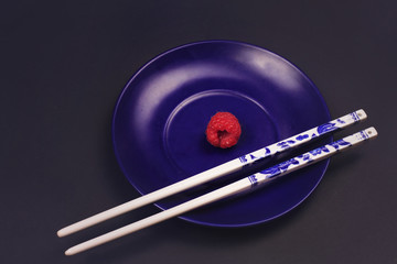 Japanese or Chinese Chop sticks on black background . Asia food and cuisine concept