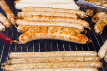 Street fast food, grilled sausages at bbq