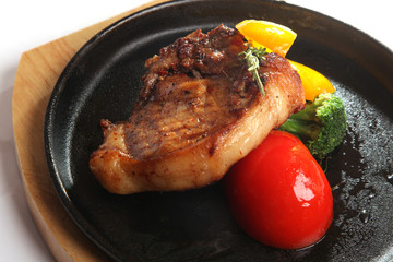 pork with vegetables in a pan