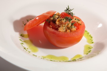 stuffed tomato with pesto sauce