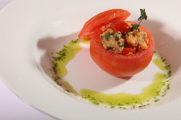 stuffed tomato with pesto sauce