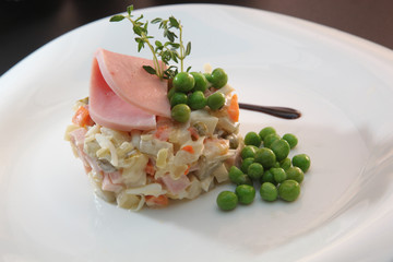 Russian salad with sausage