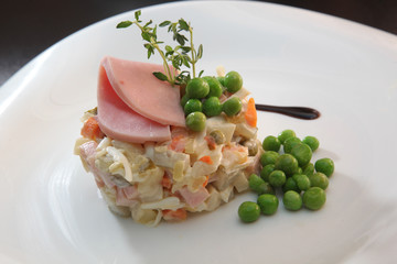 Russian salad with sausage