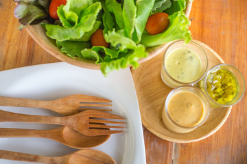Fresh healthy salad on wooden table